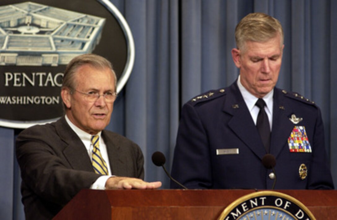 Secretary of Defense Donald H. Rumsfeld and Chairman of the Joint Chiefs of Staff Gen. Richard B. Myers, U.S. Air Force, update reporters on the progress of Operation Iraqi Freedom during a Pentagon press briefing on Aug. 5, 2003. 