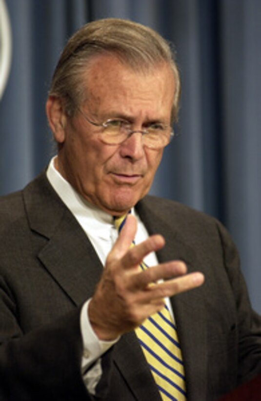 Secretary of Defense Donald H. Rumsfeld responds to a reporter's question during a Pentagon press briefing on Aug. 5, 2003. Rumsfeld and Chairman of the Joint Chiefs of Staff Gen. Richard B. Myers, U.S. Air Force, gave reporters an operational update on Operation Iraqi Freedom. 