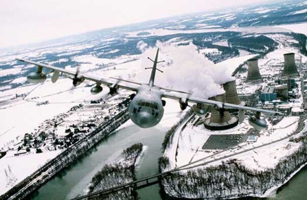 FILE PHOTO -- Flying over the Pennsylvania countryside in a training mission, the EC-130E/J Commando Solo is a specially-modified four-engine Hercules transport that conducts information operations, psychological operations and broadcasts information in various frequencies.  The 193rd Special Operations Wing, Harrisburg International Airport, Pa., has total responsibility for the Commando Solo missions. (U.S. Air Force photo)