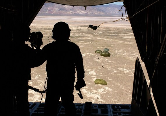 NAVAL AIR STATION FALLON, Nev. -- Air Force pararescuemen parachute from an HC-130 here during Desert Rescue XI on Aug. 11.  The airmen are assigned to the 347th Rescue Wing at Moody Air Force Base, Ga.  The joint-service combat search and rescue training exercise simulates downed aircrew behind enemy lines and allows airmen to practice rescue-related missions.  They also experiment with new techniques in realistic scenarios.  (U.S. Air Force photo by Staff Sgt. Aaron D. Allmon II)