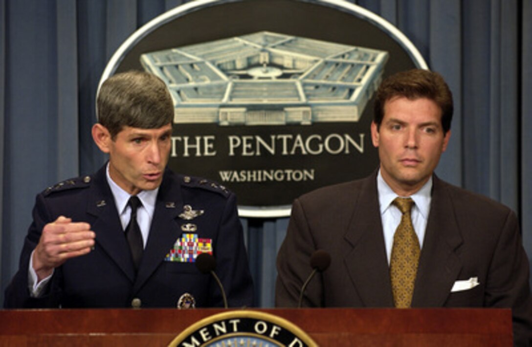Director for Operations of the Joint Staff, J-3, Lt. Gen. Norton Schwartz, U.S. Air Force, briefs reporters about U.S. forces in Liberia during a Pentagon press briefing on Aug. 13, 2003. Schwartz and Acting Assistant Secretary of Defense for Public Affairs Lawrence Di Rita also updated reporters on the coalition's progress in Iraq. 