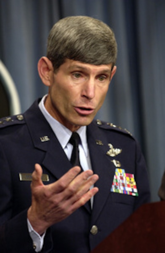 Lt. Gen. Norton Schwartz, U.S. Air Force, responds to a reporter's question as he briefs reporters about U.S. forces in Liberia during a Pentagon press briefing on Aug. 13, 2003. Schwartz and Acting Assistant Secretary of Defense for Public Affairs Lawrence Di Rita also updated reporters on the coalition's progress in Iraq. Schwartz is the director for operations, J-3, the Joint Staff. 