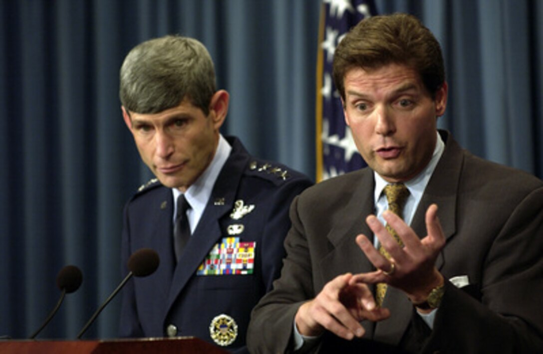 Acting Assistant Secretary of Defense for Public Affairs Lawrence Di Rita responds to a reporter's question during a Pentagon press briefing on Aug. 13, 2003. Di Rita and Air Force Lt. Gen. Norton Schwartz, director for operations, J-3, the Joint Staff, briefed reporters on U.S. forces in Liberia and the coalition's progress in Iraq. 