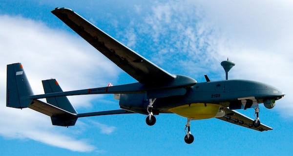 The Joint Unmanned Air Vehicle (JUAV) Experiment Program consisting of British and Israeli contractors work together controlling the UAV which can be used in various aspects of the mission during Desert Rescue XI.