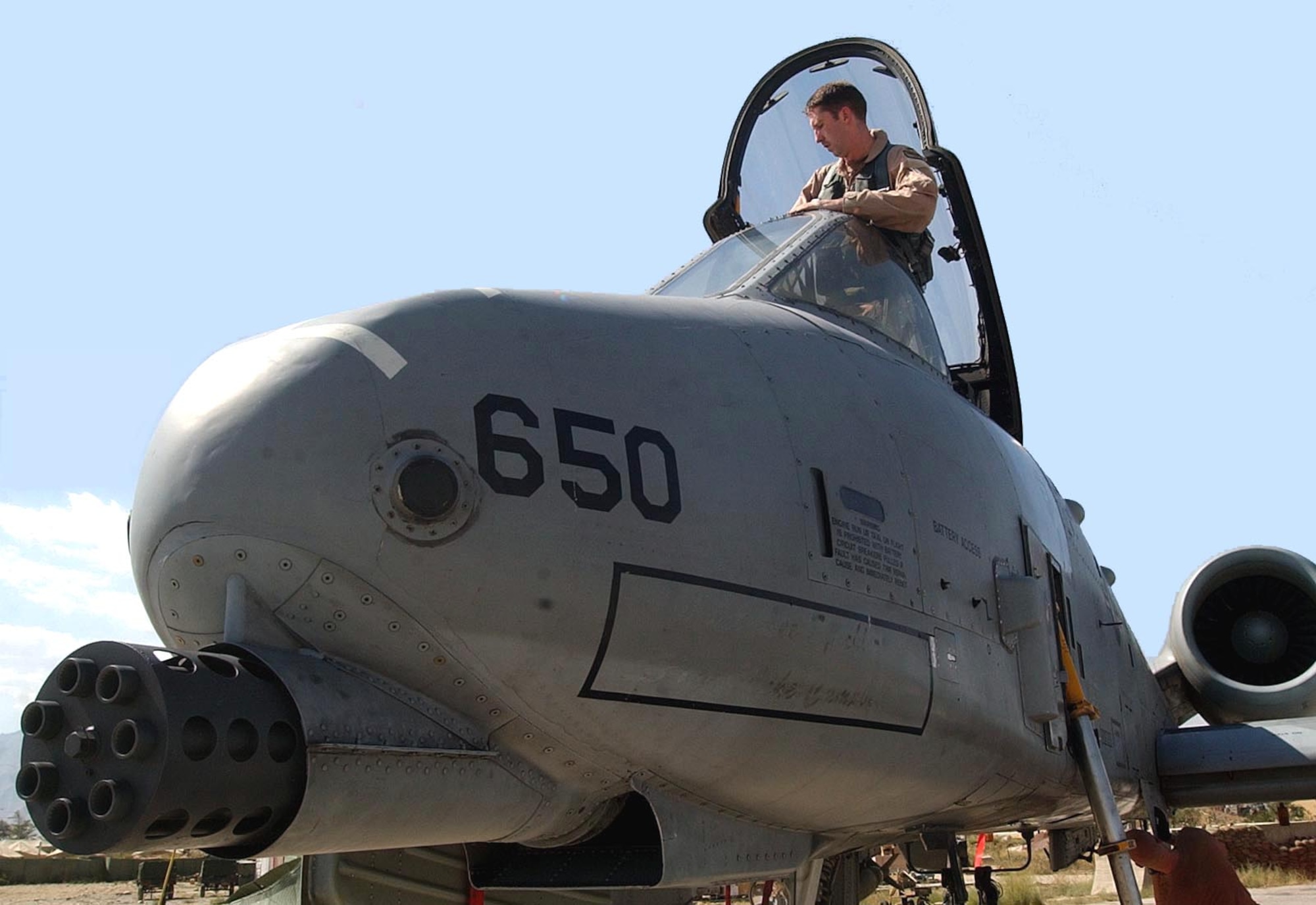 BAGRAM AIR BASE, Afghanistan -- First Lt. Erik Axt, 81st Expeditionary Fighter Squadron, emerges from his A-10 Thunderbolt II after flying a mission here Aug. 14 supporting Operation Enduring Freedom.  (U.S. Air Force photo by Staff Sgt. Russell Wicke)