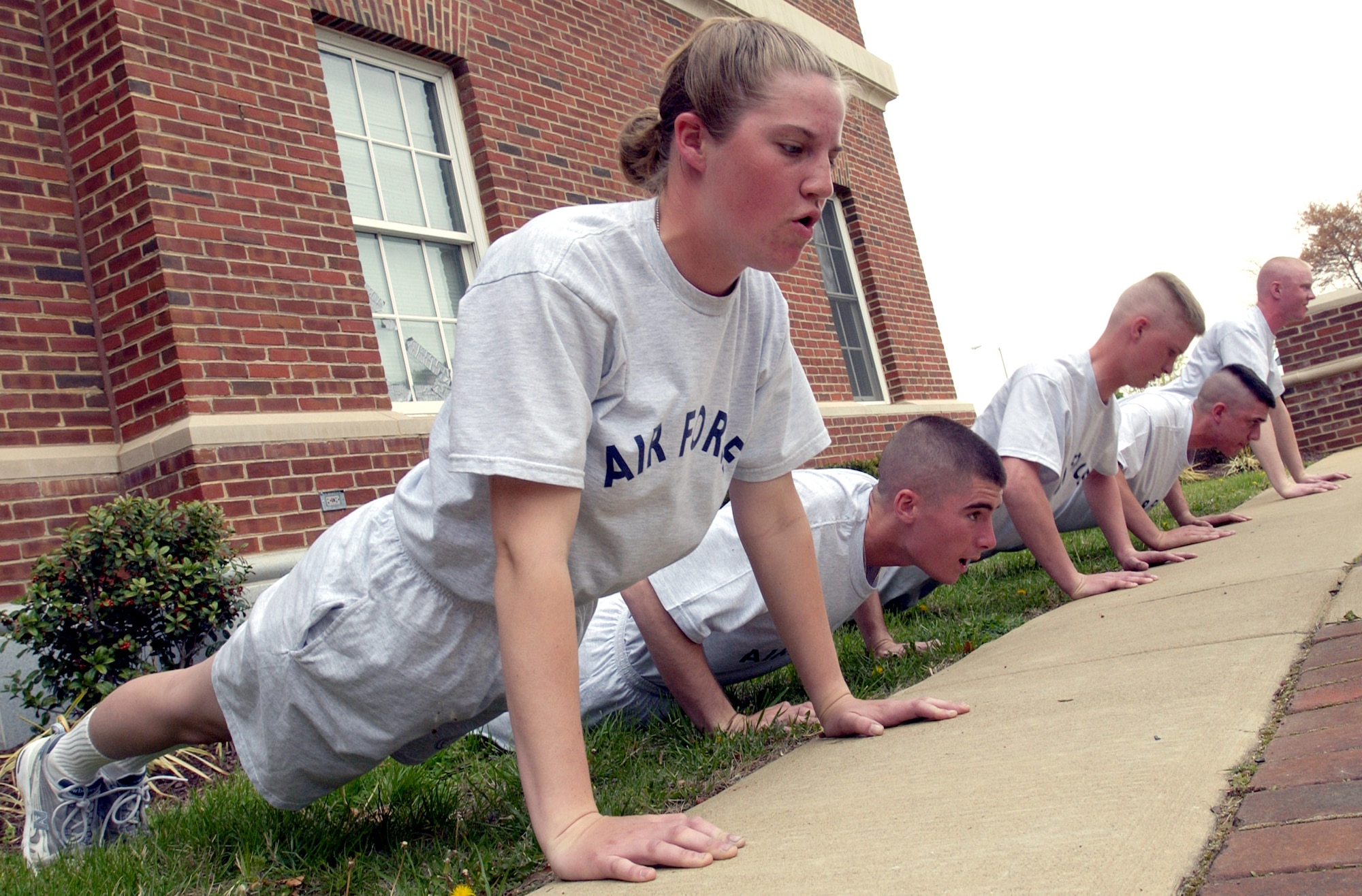 BOLLING AIR FORCE BASE, D.C. -- Trainees at the U.S. Air Force Honor Guard technical school here participate in a physical-fitness routine several times a week.  Their routine, which includes push-ups, crunches and a 1.5-mile run, mirrors the proposed Air Force fitness standards, which will be implemented in January 2004.  (U.S. Air Force photo by Master Sgt. Jim Varhegyi)