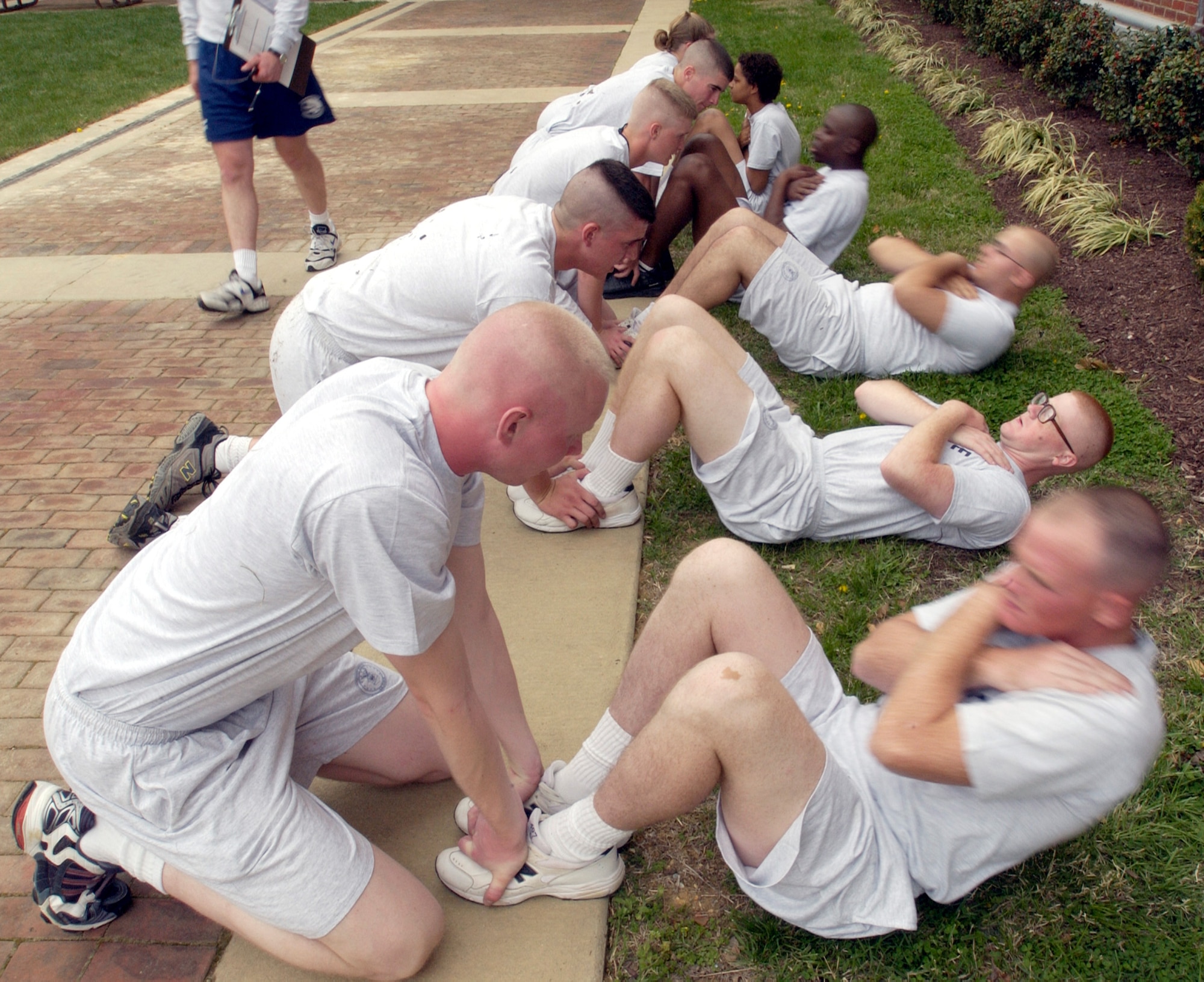 BOLLING AIR FORCE BASE, D.C. -- Trainees at the U.S. Air Force Honor Guard technical school here participate in a physical-fitness routine several times a week.  Their routine, which includes push-ups, crunches and a 1.5-mile run, mirrors the proposed Air Force fitness standards, which will be implemented in January 2004.  (U.S. Air Force photo by Master Sgt. Jim Varhegyi)