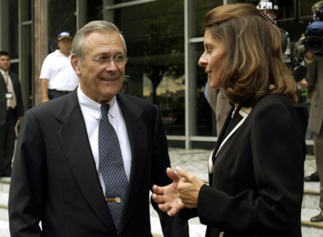 Colombian Minister of National Defense Lucia Ramirez (right) talks with Secretary of Defense Donald H. Rumsfeld after attending a briefing at the Ministry of Defense in Bogota, Colombia, on Aug. 19, 2003. Rumsfeld is in Bogota to meet with Ramirez and Colombian President Alvaro Uribe to discuss counter-drug and anti-guerilla efforts. 