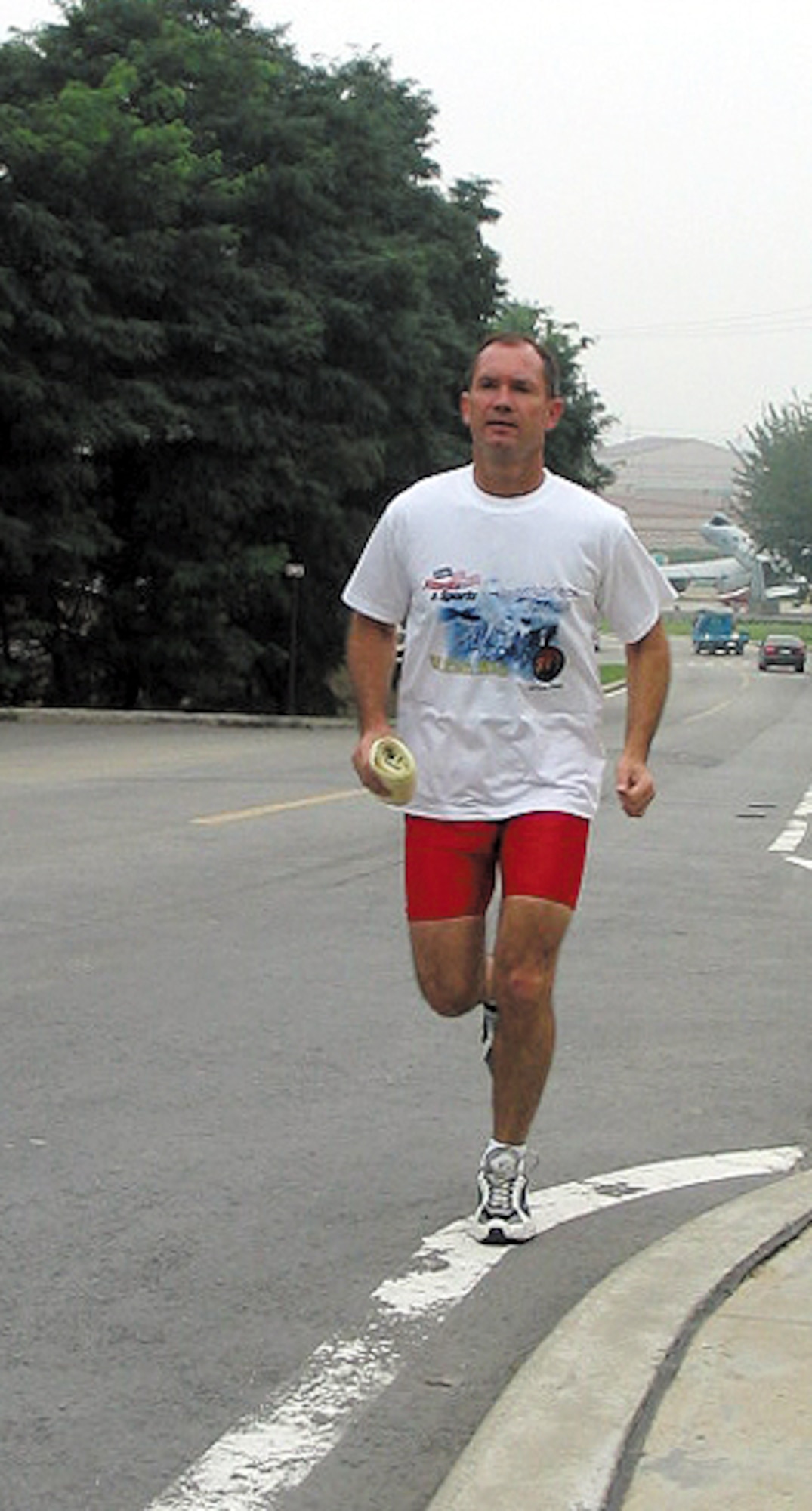 OSAN AIR BASE, South Korea -- Col. Jack Gundrum, 731st Air Mobility Squadron commander, runs a few miles here. The colonel lost 35 pounds through exercise and watching what he ate.  (U.S. Air Force photo by Senior Airman Sarah Clark)