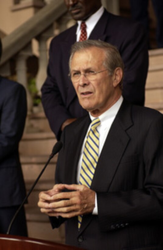 Secretary of Defense Donald H. Rumsfeld answers a question from the media during a joint press conference with Honduran President Ricardo Maduro at the Presidential House in Tegucigalpa, Honduras, on Aug. 20, 2003. Rumsfeld is in Honduras to meet with Maduro and to thank the Honduran government for sending troops to Iraq in support of the coalition forces. 