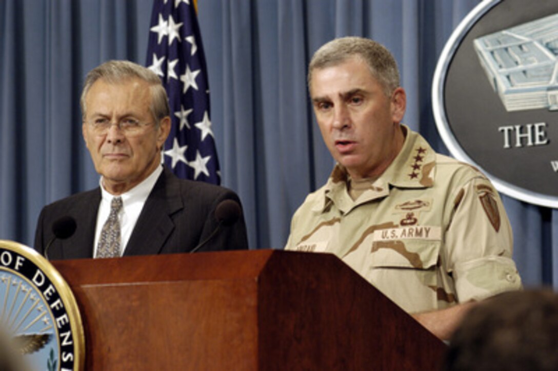 Army Gen. John P. Abizaid, commander, U.S. Central Command, and Secretary of Defense Donald H. Rumsfeld provide reporters with an operational update on the current situation in Iraq during a Pentagon press briefing on Aug. 21, 2003. Abizaid is in Washington to meet with Rumsfeld and other senior DoD leaders. 