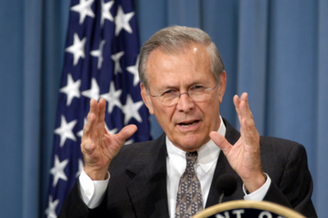 Secretary of Defense Donald H. Rumsfeld answers a reporter's question on the current situation in Iraq during a Pentagon press briefing with Army Gen. John P. Abizaid, commander, U.S. Central Command on Aug. 21, 2003. 