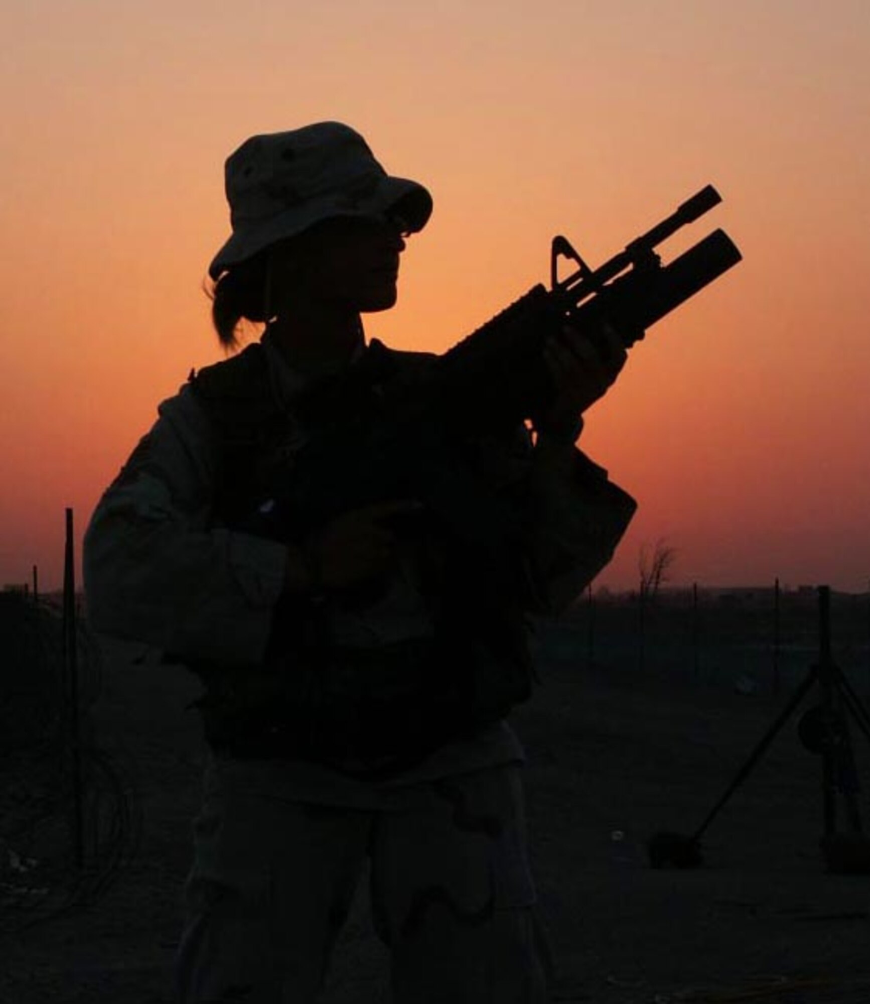 TALLIL AIR BASE, Iraq -- Airman 1st Class Wednesday Brodenburger, 822nd Security Forces Squadron, completes a pre-dawn patrol near one of the interior perimeter fences. Members of the 822nd SFS, supporting Operation Iraqi Freedom, are beginning to return home after serving more than five months here.  (U.S. Air Force photo by Staff Sgt. Robert Grande)