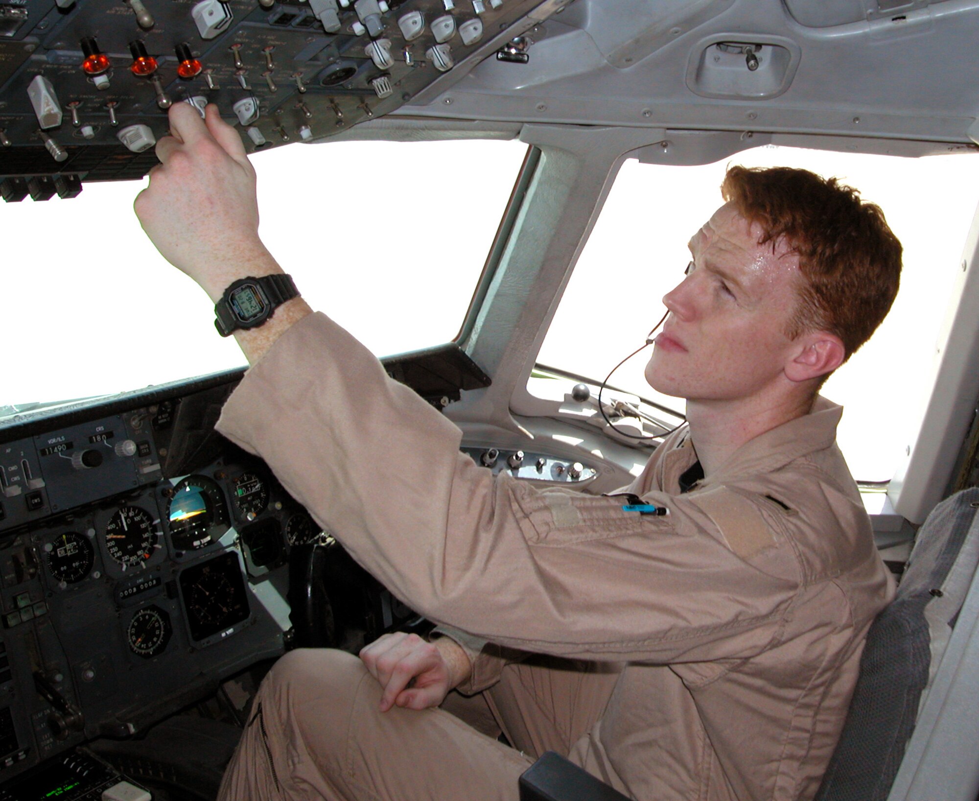 OPERATION IRAQI FREEDOM -- First Lt. Brian Huster goes through pre-flight checks on a KC-10A Extender at a forward-deployed location in Southwest Asia.  Huster is a co-pilot with the 380th Air Expeditionary Wing deployed from McGuire Air Force Base, N.J.  (U.S. Air Force photo by Maj. Robert Couse-Baker)
