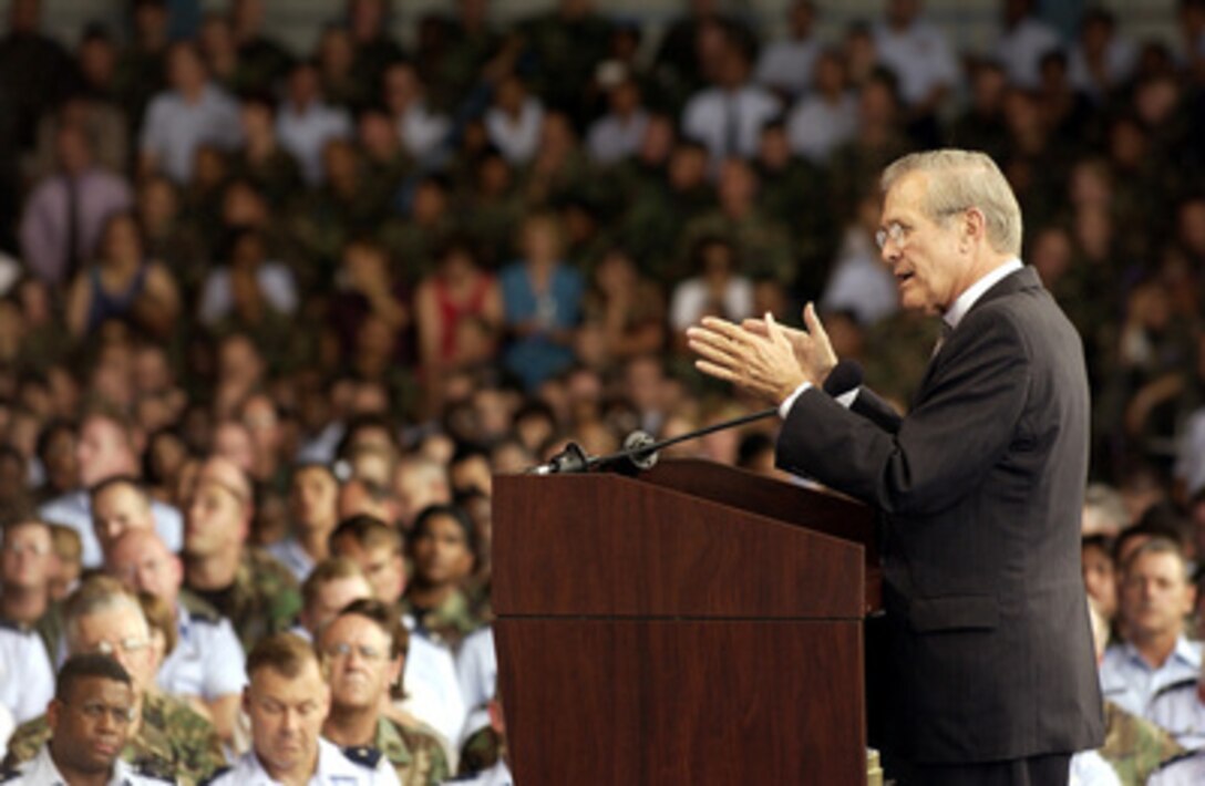 Secretary of Defense Donald H. Rumsfeld answers a question from a member of the audience during a town hall meeting at Lackland Air Force Base, San Antonio, Texas, on Aug. 25, 2003. Rumsfeld delivered his opening remarks then fielded questions from military and civilian attendees. The forum allowed people from San Antonio area bases to direct their questions to the top man at the Defense Department. 