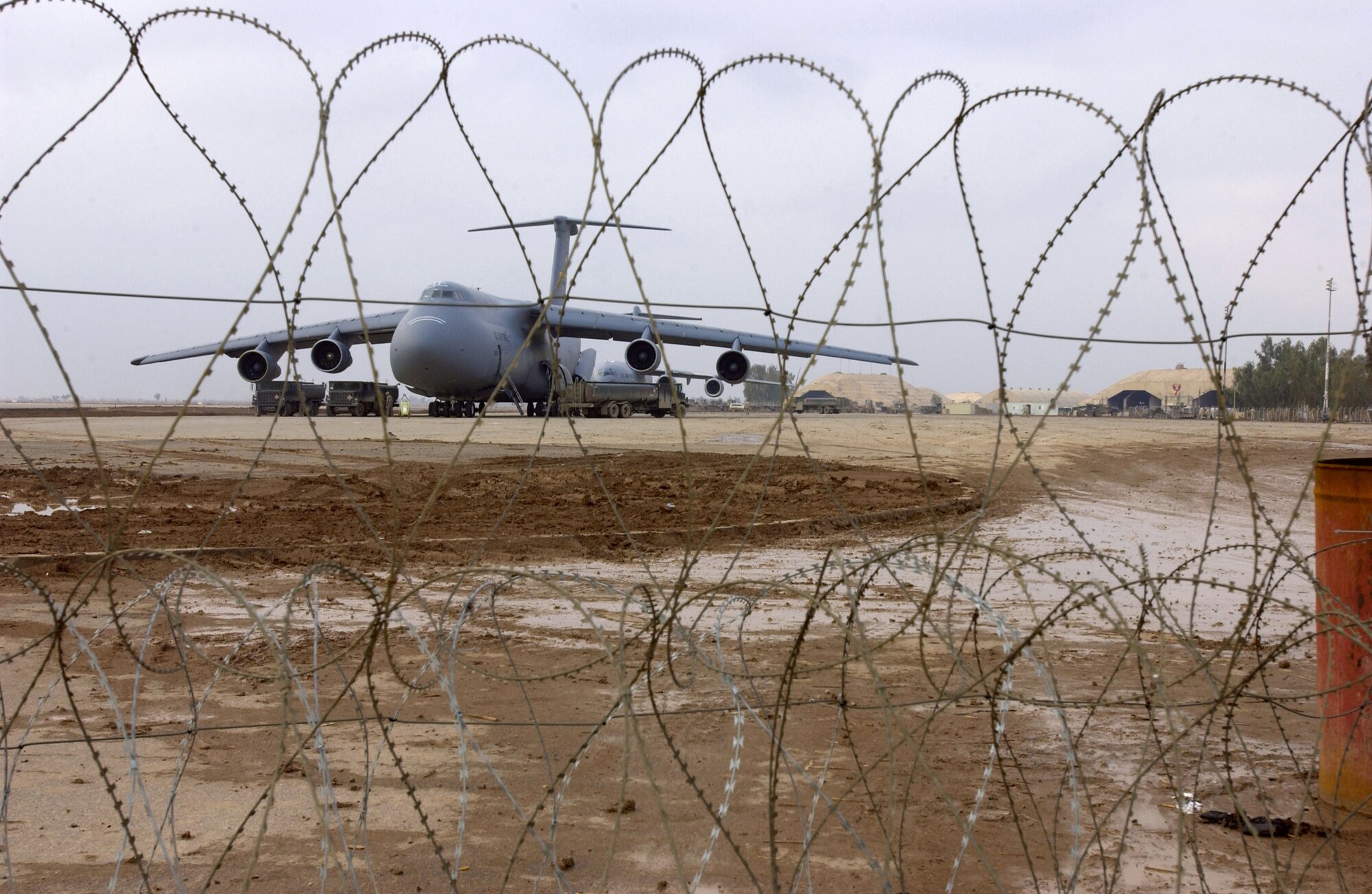 BALAD AIR BASE, Iraq -- A C-5 Galaxy sits on the ramp here Nov. 27.  The runway is large enough to allow the aircraft to use the airfield, which reduces the base's dependence on ground-vehicle convoys for supplies.  (U.S. Air Force photo by Staff Sgt. Suzanne M. Jenkins)