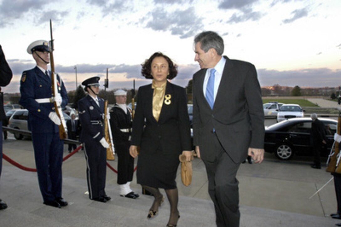 Deputy Secretary of Defense Paul Wolfowitz (right) escorts Minister of Foreign Affairs Ana De Palacio of Spain through an honor cordon and into the Pentagon on Dec. 1, 2003. Wolfowitz and De Palacio will meet to discuss the situation in Iraq and other matters of mutual interest. 