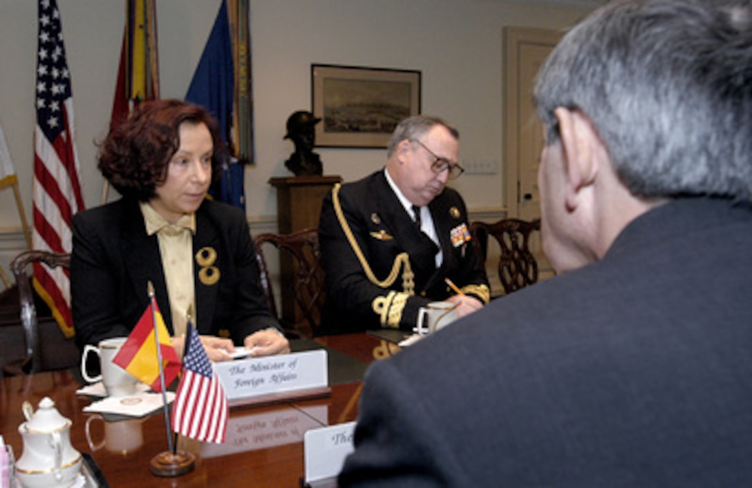 Spanish Minister of Foreign Affairs Ana De Palacio (left) and Defense Attaché Rear Adm. Teodoro De Leste (center) talk with Deputy Secretary of Defense Paul Wolfowitz (foreground) in the Pentagon on Dec. 1, 2003, about the security situation in Iraq. 