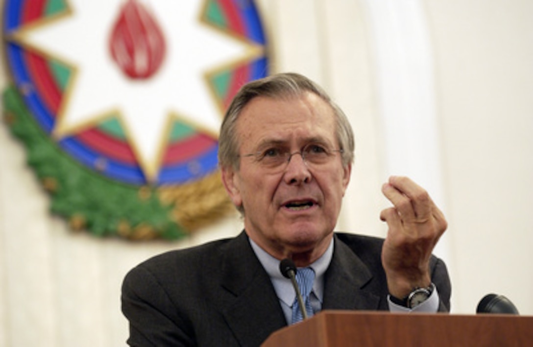 Secretary of Defense Donald H. Rumsfeld gestures to make his point as he answers a question during a joint press conference with Azerbaijani Defense Minister Col. Gen. Safar Abiyev in Baku, Azerbaijan, on Dec. 3, 2003. Rumsfeld is in Baku for talks with President Ilham Aliyev and Abiyev. 