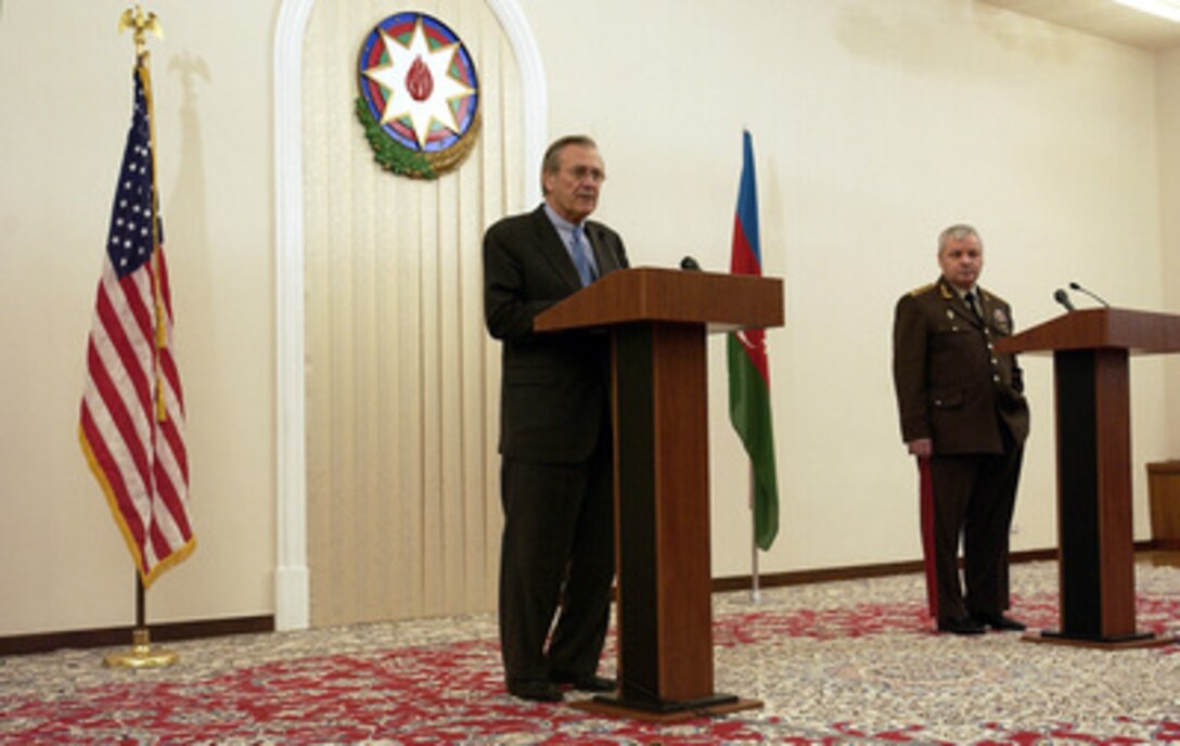 Secretary of Defense Donald H. Rumsfeld makes his opening remarks during a joint press conference with Azerbaijani Defense Minister Col. Gen. Safar Abiyev at Baku, Azerbaijan, on Dec. 3, 2003. Rumsfeld is in Baku for bilateral talks with President Ilham Aliyev and Abiyev. 