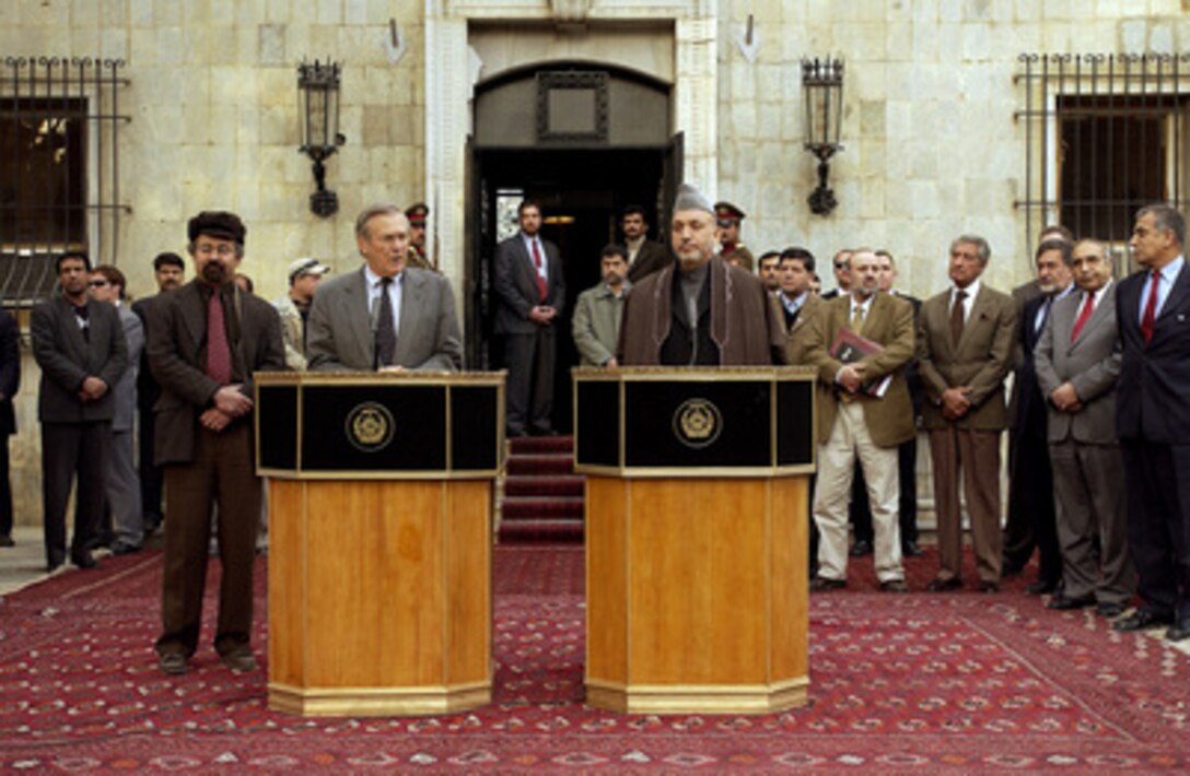 Secretary of Defense Donald H. Rumsfeld and Afghanistan's President Hamid Karzai conduct a joint press conference after their meeting in Kabul, Afghanistan, on Dec. 4, 2003. Rumsfeld and Karzai briefed reporters on their talks and the coalition's progress in Afghanistan. 