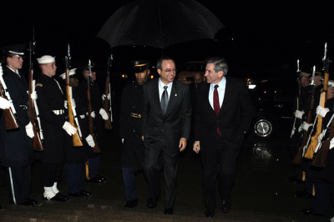 Deputy Secretary of Defense Paul Wolfowitz escorts Jordanian Minister of Foreign Affairs Marwan Muasher into the Pentagon on Dec. 5, 2003. The two leaders are meeting to discuss defense issues of mutual interest. 