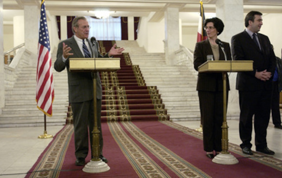 Secretary of Defense Donald H. Rumsfeld and Georgia's Acting President Nino Burjanadze brief reporters about their meetng during a joint press conference at Tbilisi, Georgia, on Dec. 5, 2003. Rumsfeld is in Georgia to meet with Burjanadze, Minister of Defense Gen. David Tevzadze and to visit with U.S. troops deployed there. 