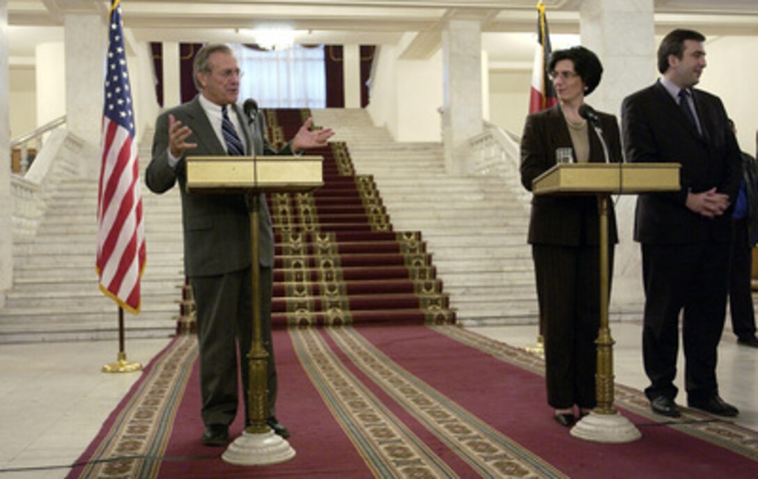 Secretary of Defense Donald H. Rumsfeld and Georgia's Acting President Nino Burjanadze brief reporters about their meetng during a joint press conference at Tbilisi, Georgia, on Dec. 5, 2003. Rumsfeld is in Georgia to meet with Burjanadze, Minister of Defense Gen. David Tevzadze and to visit with U.S. troops deployed there. 