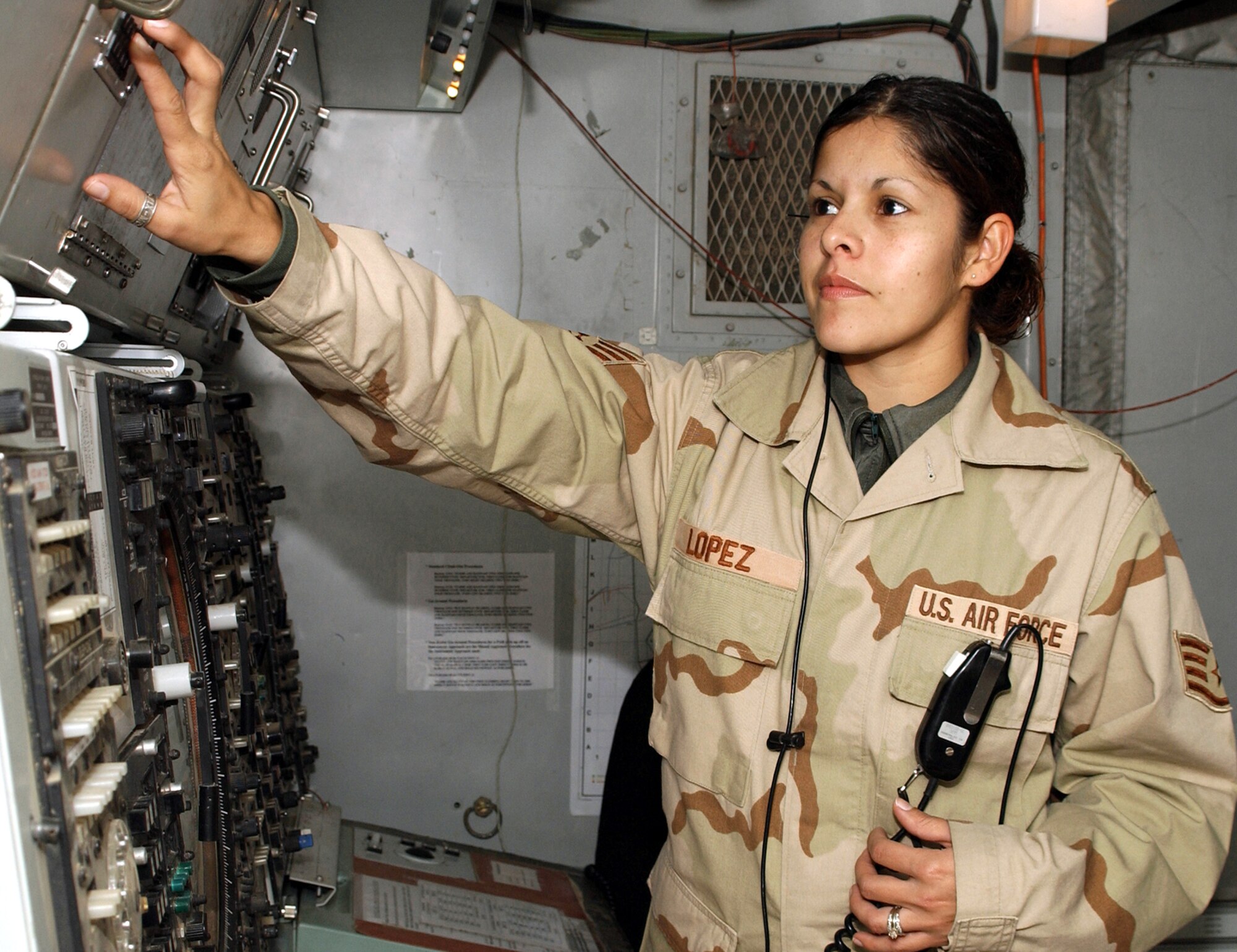 KIRKUK AIR BASE, Iraq -- Staff Sgt. Eugenia Lopez monitors equipment in the central radar approach control facility here.  The controllers here are responsible for air traffic in all of northern Iraq.  (U.S. Air Force photo by Airman 1st Class Alicia Sarkkinen)