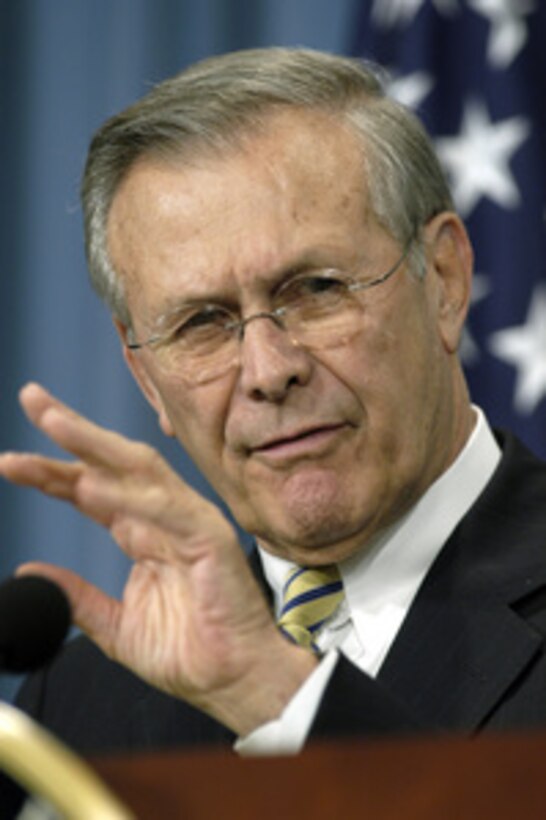 Secretary of Defense Donald H. Rumsfeld smiles as he responds to a reporter during the Pentagon press briefing on Dec. 9, 2003. Rumsfeld and Chairman of the Joint Chiefs of Staff Gen. Richard B. Myers, U.S. Air Force, updated reporters on the progress of the Iraqi security forces training and the coalitions' efforts in Iraq. 