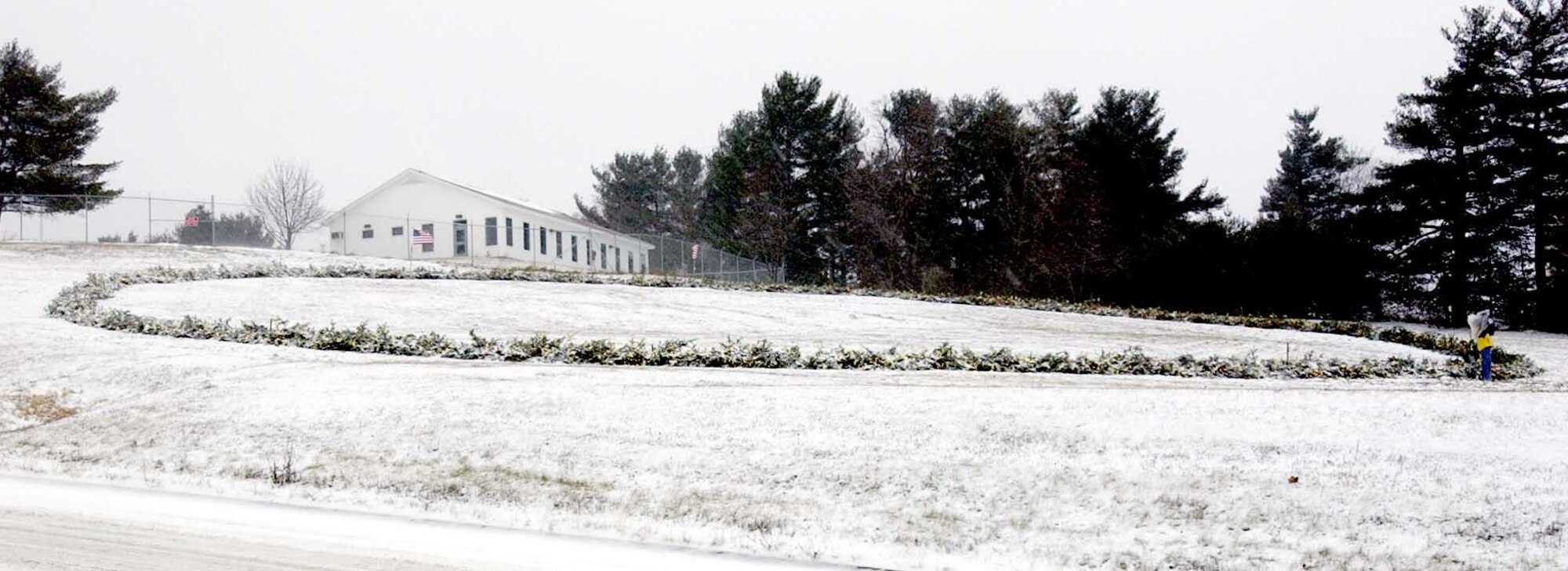 AUGUSTA, Maine -- A Christmas wreath that is 150 feet across and 496 feet around sits outside the Maine National Guard headquarters here, in tribute to servicemembers engaged in the war against terrorism.  (U.S. Army photo by Master Sgt. Angela Blevins)