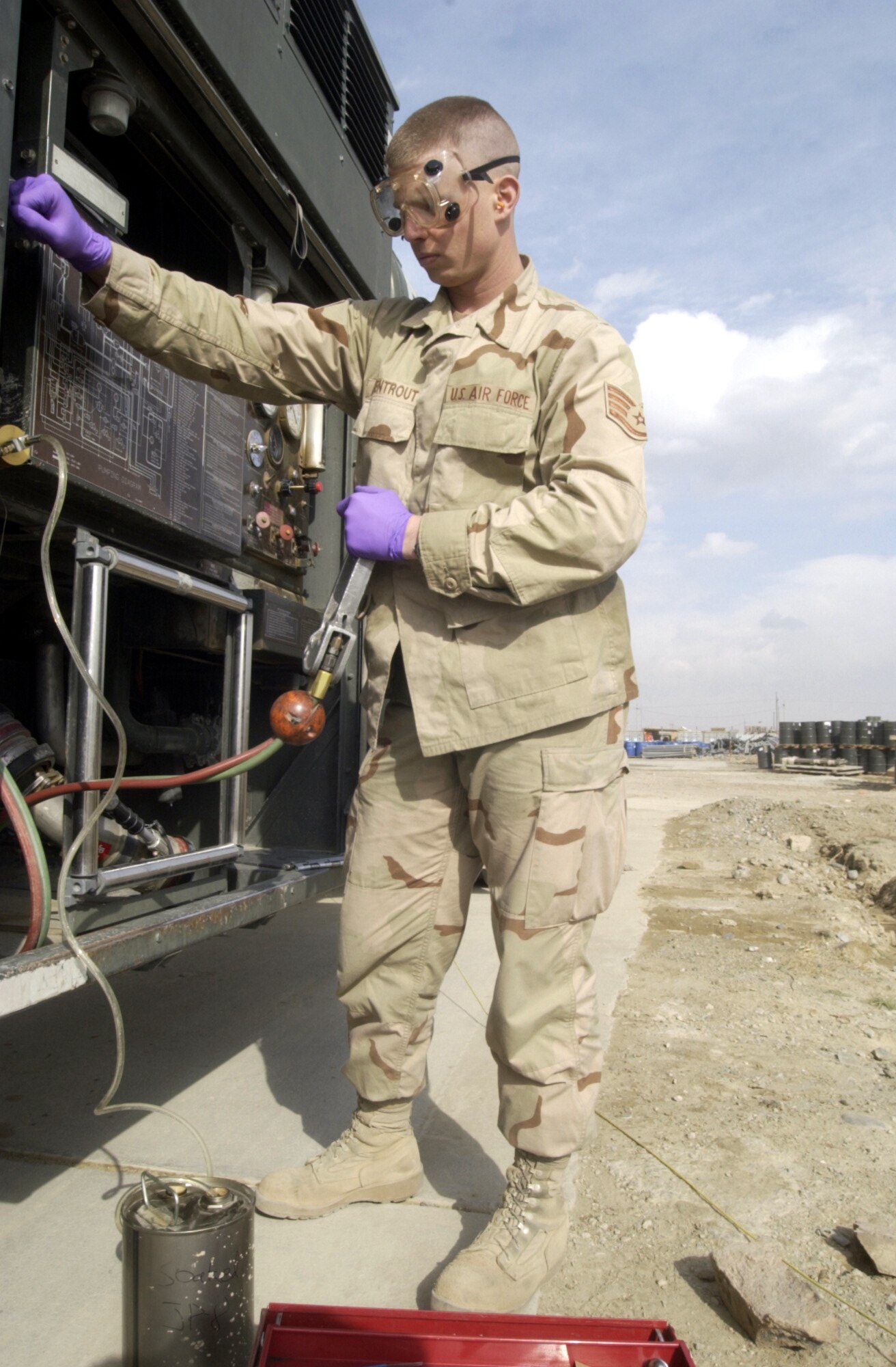 BAGRAM AIR BASE, Afghanistan -- Staff Sgt. Robert Armentrout takes a fuel sample to check for water particles.  Armentrout is a fuels specialist assigned to the 455th Expeditionary Operations Group.  (U.S. Air Force photo by Tech. Sgt. Brian Davidson)
