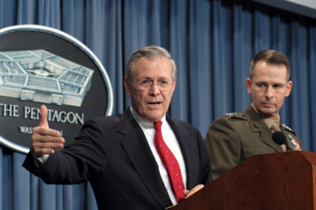 Secretary of Defense Donald Rumsfeld explains the difficulty in capturing Saddam Hussein to reporters during a Pentagon press conference on Dec. 16, 2003. Rumsfeld and Vice Chairman of the Joint Chiefs of Staff Gen. Peter Pace, U.S. Marine Corps, updated reporters with the latest information on the December 13th discovery and capture of Saddam by the U.S Army's 4th Infantry Division, U.S. Special Operations forces and coalition troops. 
