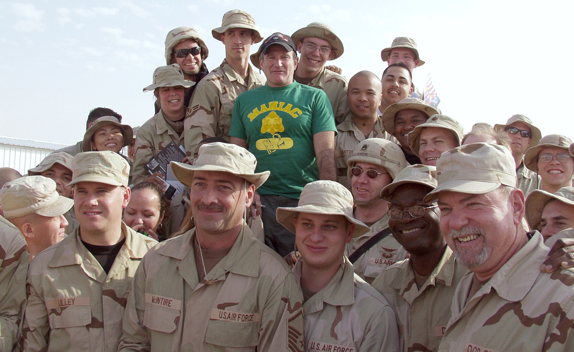 KIRKUK AIR BASE, Iraq -- Academy Award-winning actor and comedian Robin Williams is surrounded by military admirers following a holiday-tour stop here Dec. 17.  Williams and other celebrities are visiting military forces, along with Gen. Richard B. Myers, chairman of the Joint Chiefs of Staff, as part of a United Service Organizations-sponsored tour.  (U.S. Air Force photo by Tech. Sgt. Jeffrey Williams)