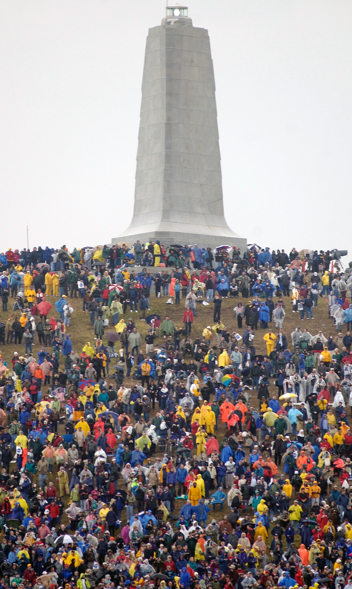 KILL DEVIL HILLS, N.C. -- More than 34,000 aviation enthusiasts braved hours of bitter cold and drenching rains at the Wright Brothers National Memorial here Dec. 17 hoping to witness the 100th anniversary of the "12 seconds that changed the world."  (U.S. Air Force photo by Master Sgt. Jim Varhegyi)