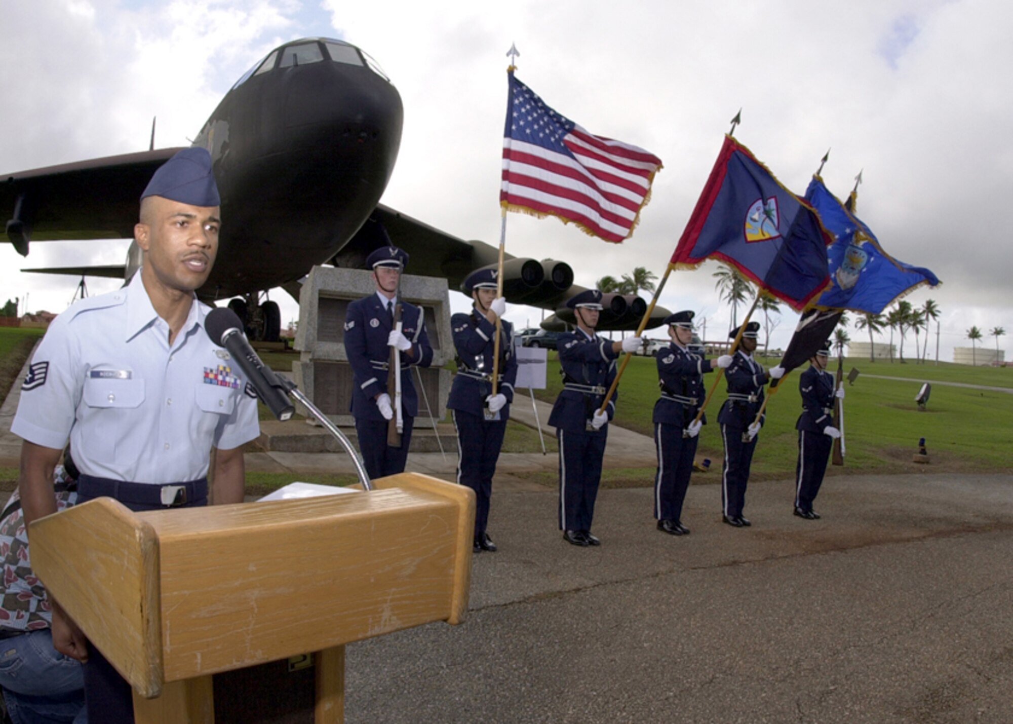 ANDERSEN AIR FORCE BASE, Guam -- Staff Sgt. Calvin Roebuck Jr. sings "The Star-Spangled Banner" while airmen of the Andersen Blue Knights Honor Guard present the colors during the Linebacker II ceremony here Dec. 18.  Roebuck is assigned to the 36th Communications Squadron.  (U.S. Air Force photo by Senior Airman Joshua Strang)