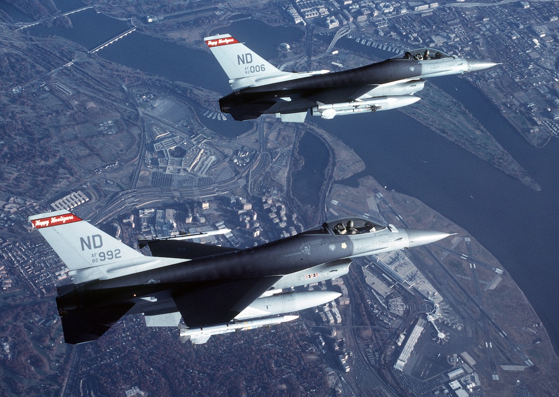 OPERATION NOBLE EAGLE --Two Air-Defense Fighter  F-16A Fighting Falcons from the North Dakota Air National Guard’s 178th Fighter Squadron fly in formation Nov. 17, 2001 during a combat air patrol mission over Washington in support of Operation Noble Eagle. North American Aerospace Defense Command had more than 100 ANG and Air Force Reserve fighters from 26 locations providing homeland defense, with 100 additional fighters backing them up. Additionally, more than 20 ANG and AFRES tankers are airborne every day to keep fighters refueled. (U.S. Air Force photo by Staff Sgt. Greg L. Davis)