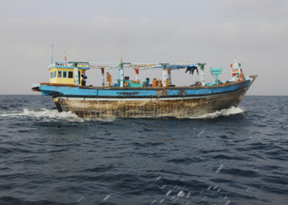 Sailors from the USS Decatur (DDG 73) pilot a 40-foot dhow underway in the Persian Gulf on Dec. 16, 2003. A U.S. Navy boarding team operating from the guided missile destroyer USS Decatur discovered an estimated two tons of narcotics with a street value of around eight to ten million dollars aboard the dhow. The dhow's 12 crewmembers were taken into custody and transferred to USS Decatur, while Decatur sailors took control of the craft and its cargo. 