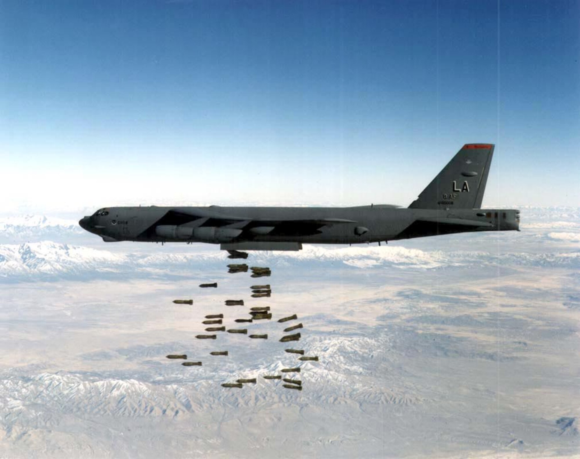 OVER NEVADA -- A B-52H Stratofortress drops a load of M-117 750-pound bombs during a training run here. During Desert Storm, B-52s delivered 40 percent of all the weapons dropped by coalition forces. The first Gulf War saw the longest strike mission in the history of aerial warfare when B-52s took off from Barksdale Air Force Base, La., launched conventional air-launched cruise missiles and returned to Barksdale -- a 35-hour, non-stop combat mission. (U.S. Air Force photo)