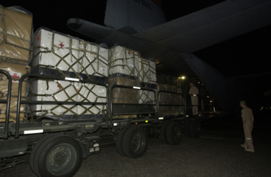 Five pallets containing 20 thousand pounds of medical supplies are loaded onto a U.S. Central Air Forces C-130 preparing for a flight to Kerman, Iran, on Dec. 28, 2003, two days after a devastating earthquake destroyed the city of Bam, Iran. 