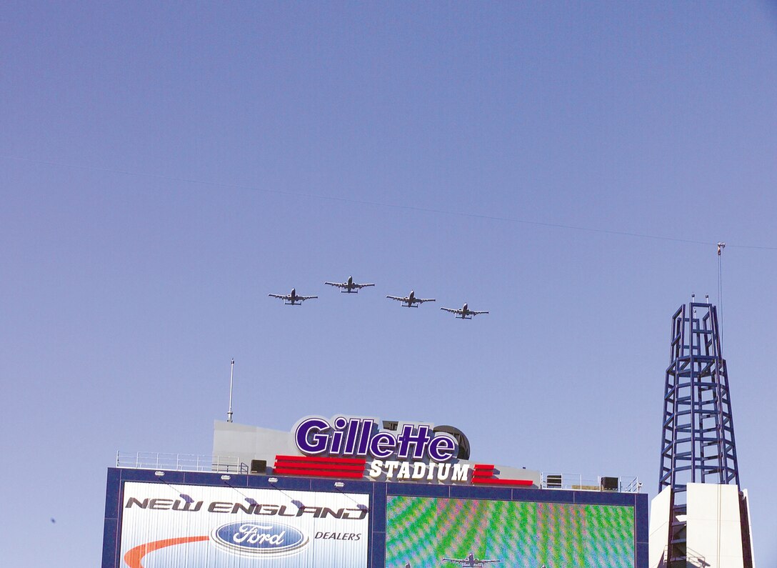 FOXBORO, Mass. -- A-10 Thunderbolt IIs from the 104th Fighter Wing at Barnes Air National Guard Base, Mass., fly over Gillette Stadium here during the pregame ceremony Dec. 27.  The New England Patriots football team hosted more than 75 servicemembers from all of the U.S. services at the game to show their appreciation for those who deployed overseas supporting operations Enduring Freedom and Iraqi Freedom.  (U.S. Air Force photo by Tech. Sgt. Eric M. Grill)