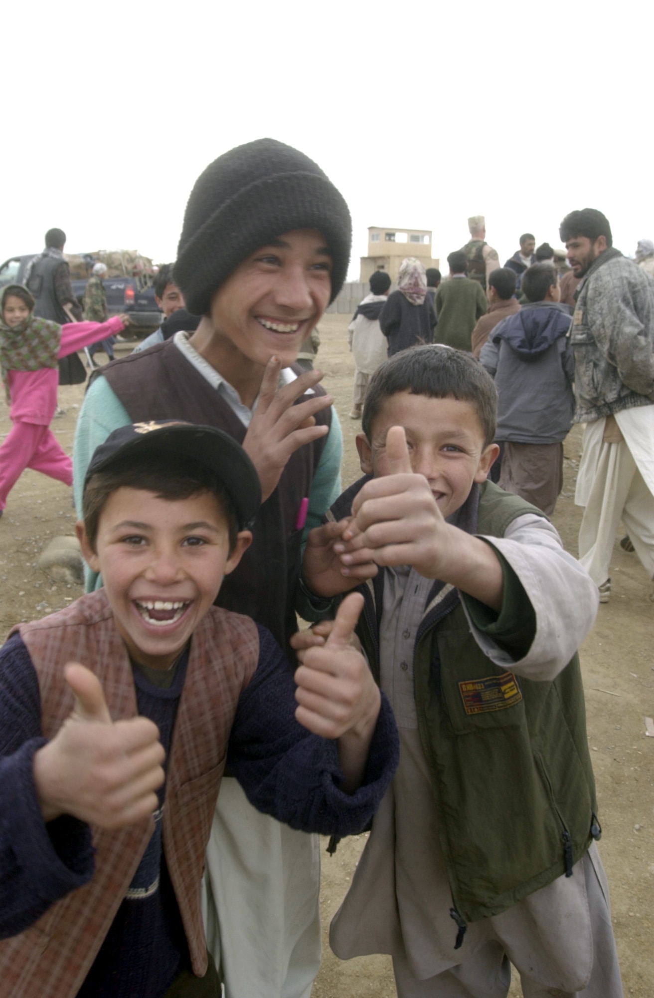 JANGADAM VILLAGE, Afghanistan -- Children here greet 455th Expeditionary Operations Group airmen during the delivery of humanitarian supplies Dec. 31.  (U.S. Air Force photo by Tech. Sgt. Brian Davidson)
