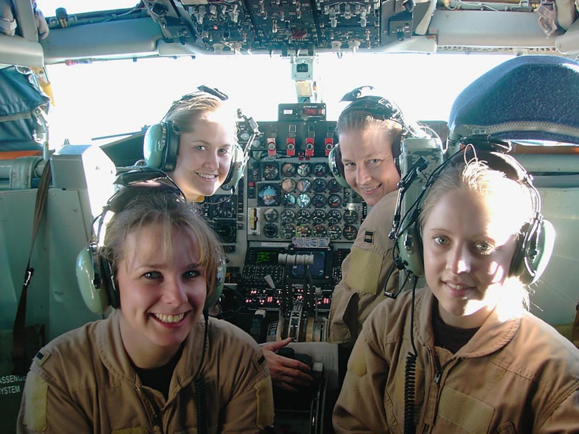 OPERATION ENDURING FREEDOM -- (Clockwise from lower left) 1st Lt. Alison, Capts. Heather and Waynetta and, Senior Airman Lyndi, all from the 376th Expeditionary Air Refueling Squadron, flew an all-female KC-135 Stratotanker air refueling mission over Afghanistan on Jan. 31. (U.S. Air Force photo by Capt. Elizabeth Ortiz)