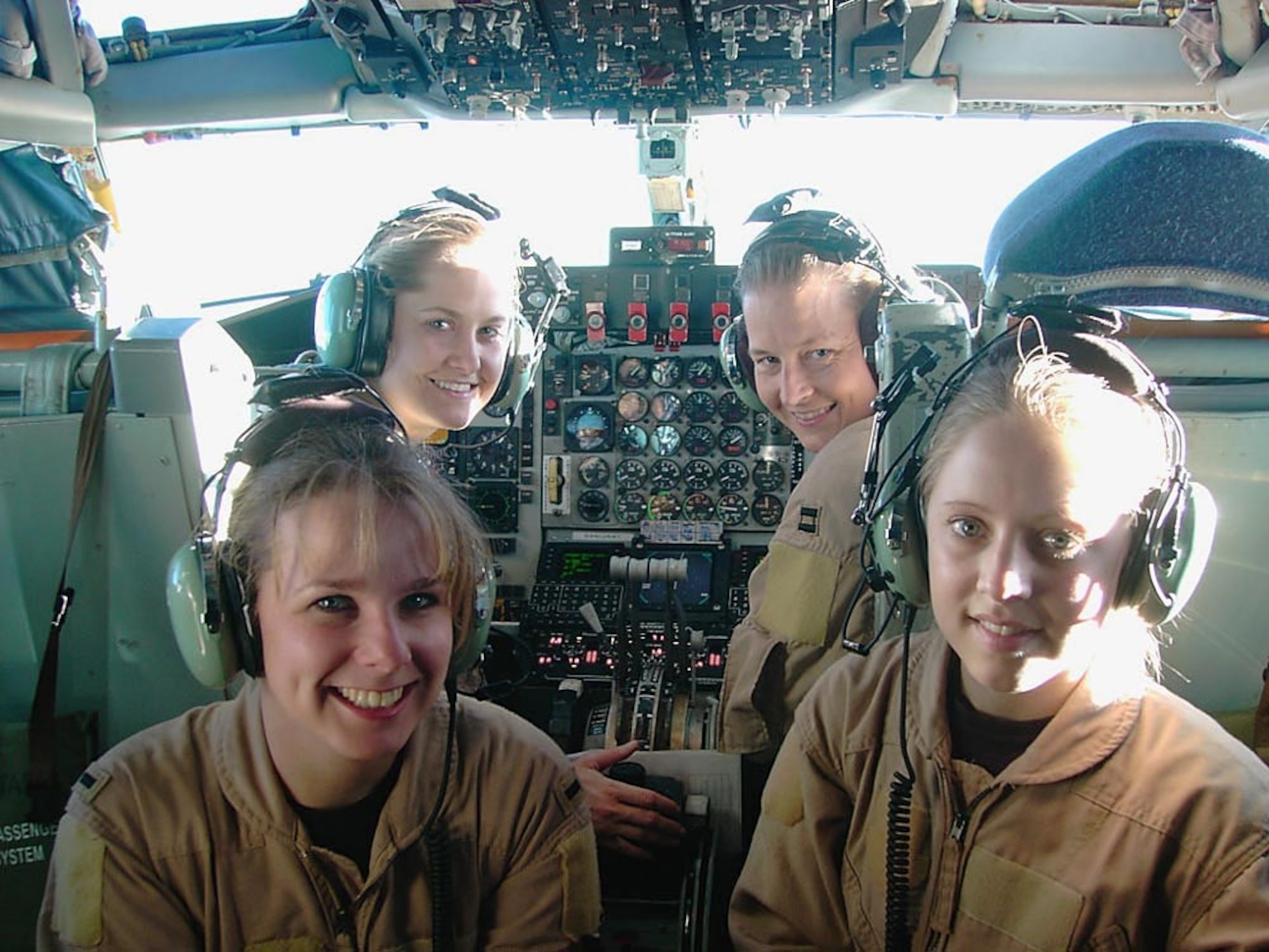 OPERATION ENDURING FREEDOM -- (Clockwise from lower left) 1st Lt. Alison, Capts. Heather and Waynetta and, Senior Airman Lyndi, all from the 376th Expeditionary Air Refueling Squadron, flew an all-female KC-135 Stratotanker air refueling mission over Afghanistan on Jan. 31. (U.S. Air Force photo by Capt. Elizabeth Ortiz)