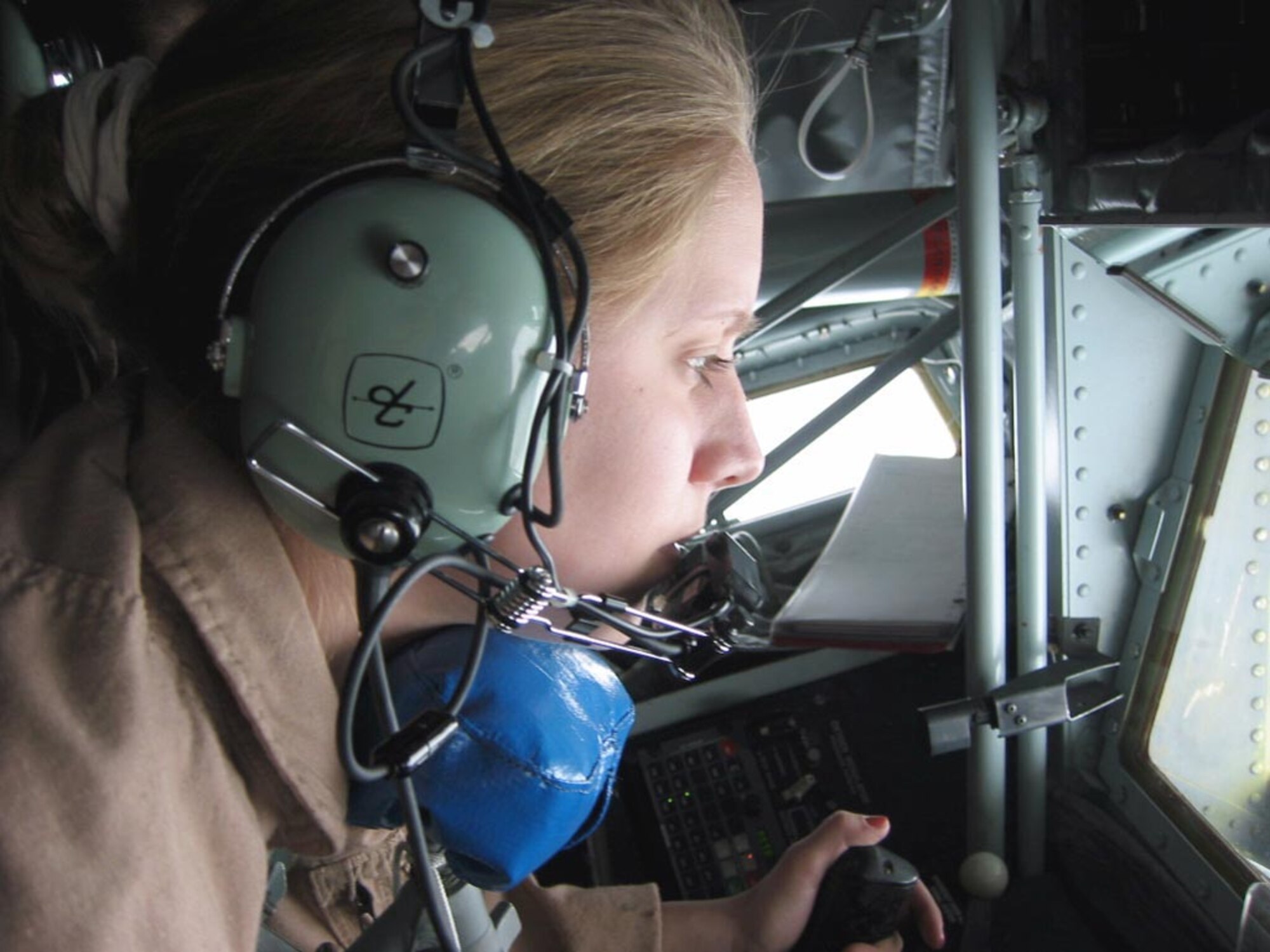 OPERATION ENDURING FREEDOM -- Senior Airman Lyndi talks to F-16 pilots from the European participating air forces as she prepares to refuel their aircraft during an air refueling mission over Afghanistan. Lyndi is a KC-135 Stratotanker boom operator currently assigned to the 376th Expeditionary Air Refueling Squadron at Ganci Air Base, Kyrgyzstan. She was part of an all-female crew that flew Jan. 31. (Courtesy photo)