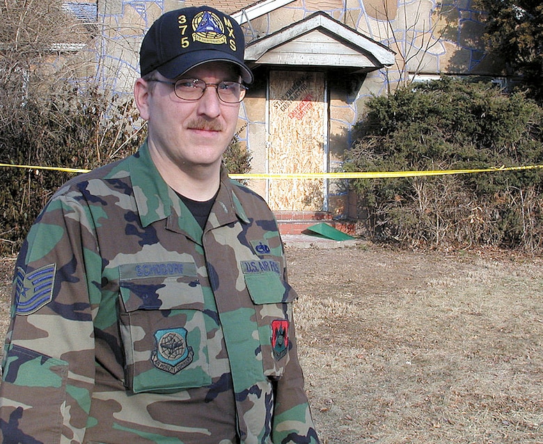 SCOTT AIR FORCE BASE, Ill. -- Tech. Sgt. Tim Schodorf was driving with his wife in their neighborhood when he spotted smoke coming from this house. Inside, an elderly woman was having trouble getting out. Schodorf ran in and helped her to safety. He is assigned to the 375th Maintenance Squadron at Scott Air Force Base, Ill. (U.S. Air Force photo by Bob Fehringer)