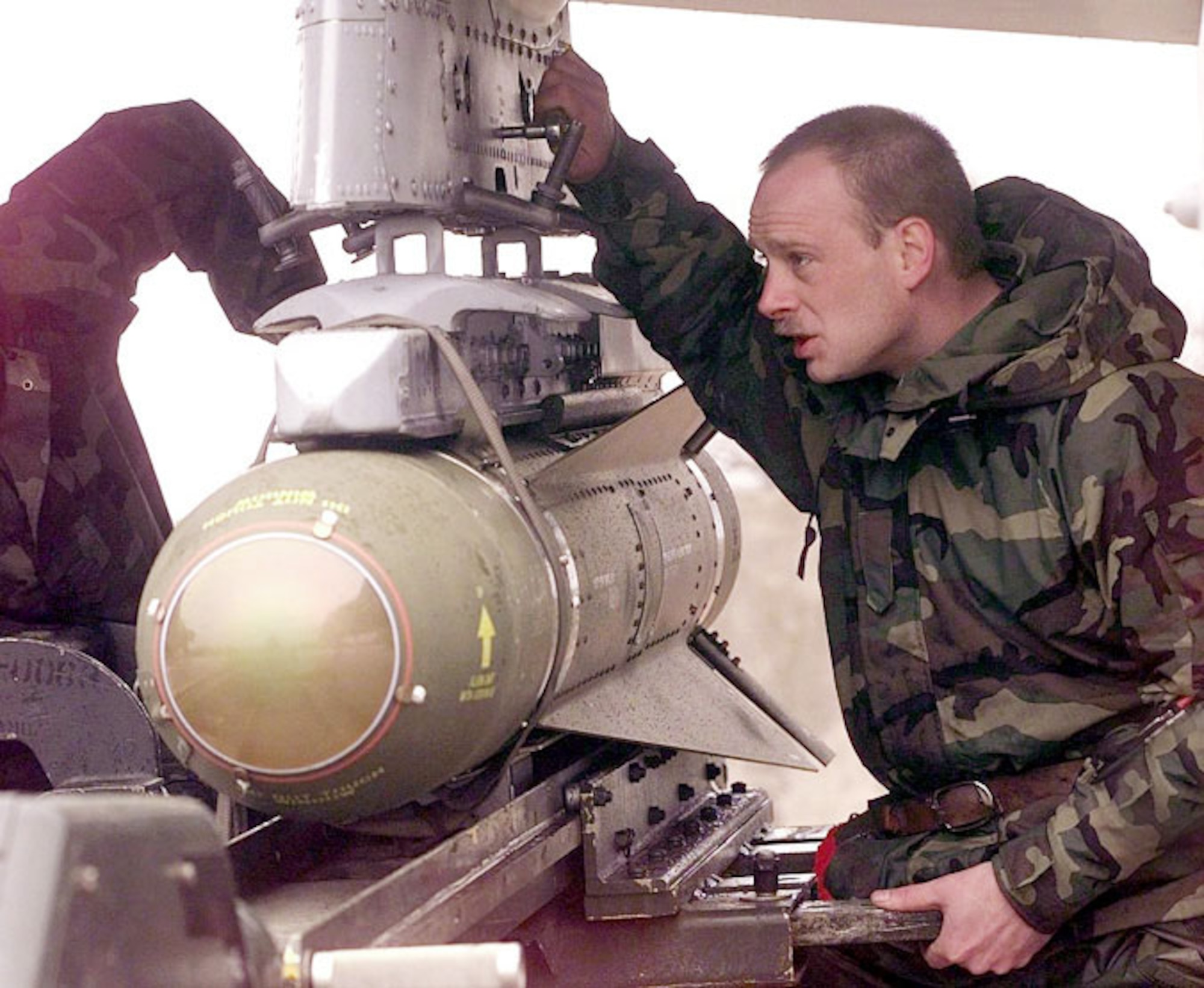 1990's -- GIOIA DEL COLLE, Italy -- Staff Sgt. Todd Kenny helps position an AGM-65 Maverick missile underneath the wing of an A-10 Thunderbolt II.  Kenny, of Lake Luzerene, New York, is part of the 81st Expeditionary Fighter Squadron. The 81st EFS is based at Spangdahlem Air Base, Germany, and is supporting NATO Operation Allied Force.
