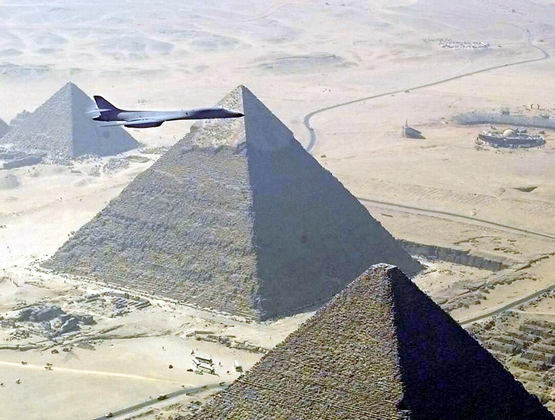 OVER EGYPT -- A B-1B from the 28th Bomb Wing at Ellsworth Air Force Base, S.D., flies over the pyramids in Egypt during Bright Star '99. Four B-1s from Ellsworth were among the 396 coalition aircraft that flew more than 3,000 sorties during the joint and combined coalition exercise involving 11 countries. (U.S. Air Force photo)