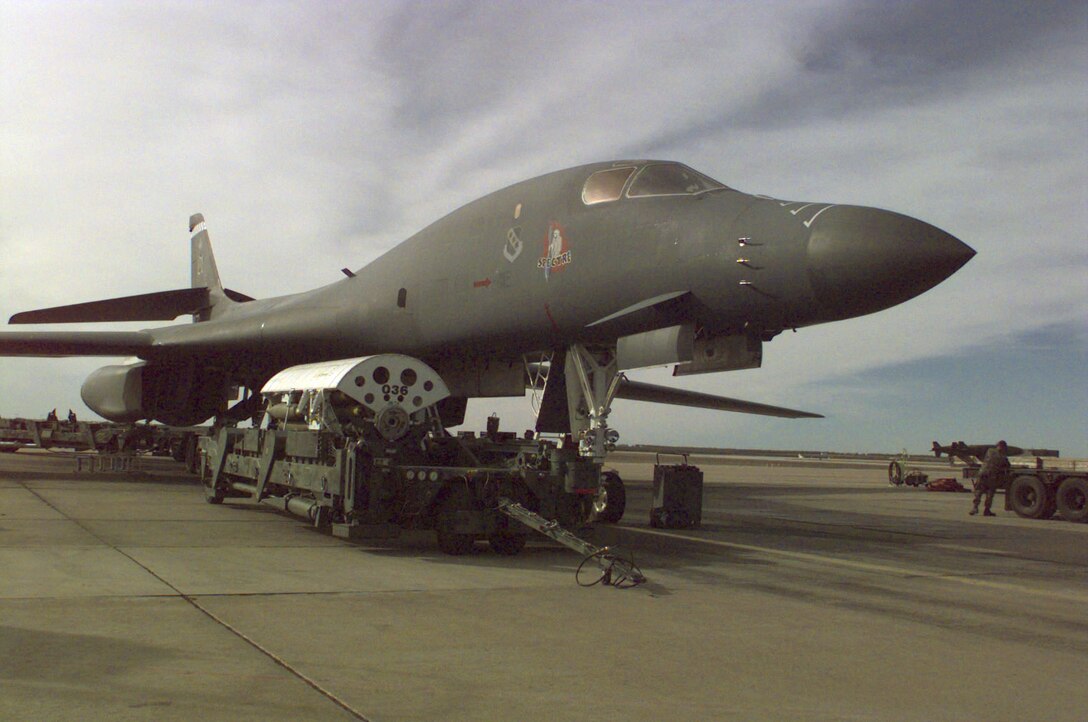 OPERATION DESERT FOX -- A 28th Bomb Squadron B-1B Lancer from Ellsworth Air Force Base, S.D., awaits as numerous MK-82 bombs are loaded and the aircraft is prepared for immediate deployment to the Gulf region in support of Operation Desert Fox, Dec. 17, 1998. (U.S. Air Force photo by Staff Sgt. Krista M. Foeller)  