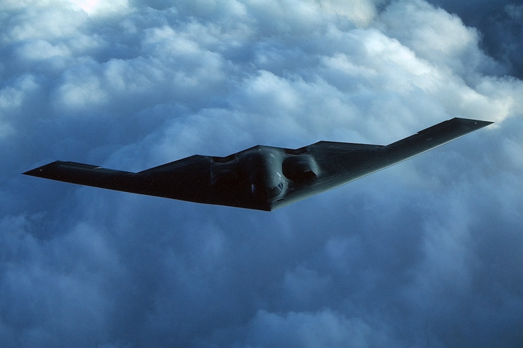 FILE PHOTO -- The B-2 Spirit is a multi-role bomber capable of delivering both conventional and nuclear munitions. A dramatic leap forward in technology, the bomber represents a major milestone in the U.S. bomber modernization program. The B-2 brings massive firepower to bear, in a short time, anywhere on the globe through previously impenetrable defenses. Along with the B-52 and B-1B, the B-2 provides the penetrating flexibility and effectiveness inherent in manned bombers. Its low-observable, or "stealth," characteristics give it the unique ability to penetrate an enemy's most sophisticated defenses and threaten its most valued, and heavily defended, targets. Its capability to penetrate air defenses and threaten effective retaliation provide a strong, effective deterrent and combat force well into the 21st century. (U.S. Air Force Photo by Staff Sgt. Andy Dunaway)